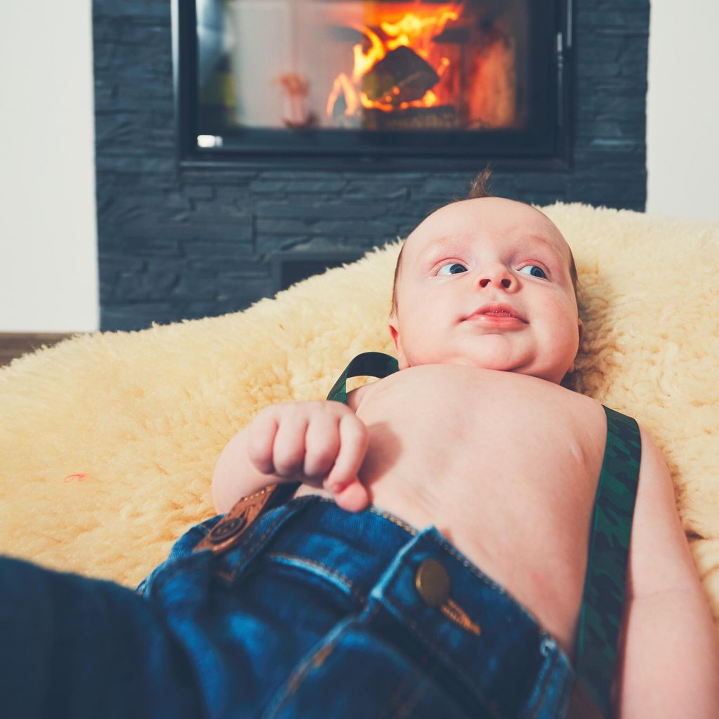 Cheerful little boy at home