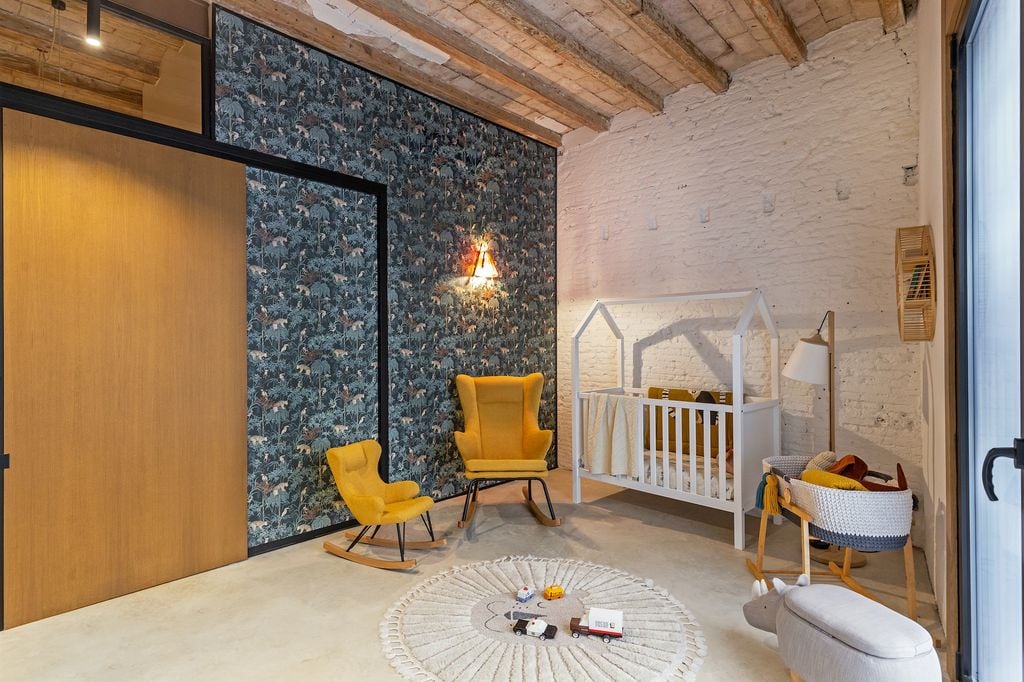 Children's bedroom with white painted brick walls. 