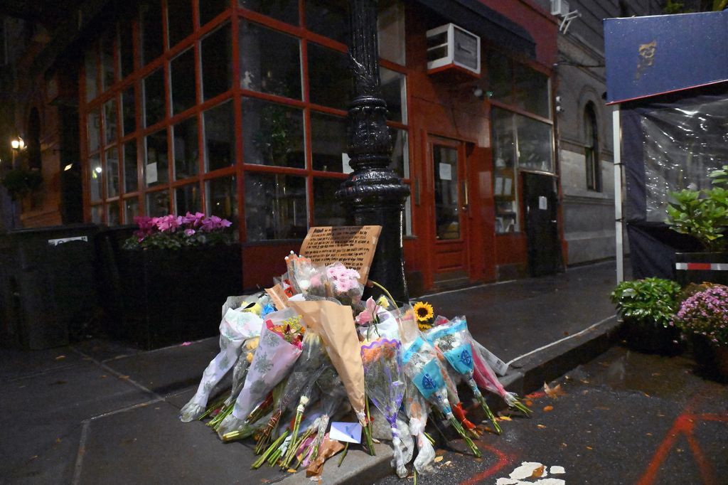 Flowers for Matthew Perry on the doors of his New York apartment