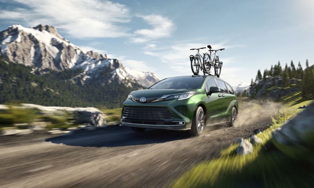 2021 Toyota Sienna (green with bikes on roof)