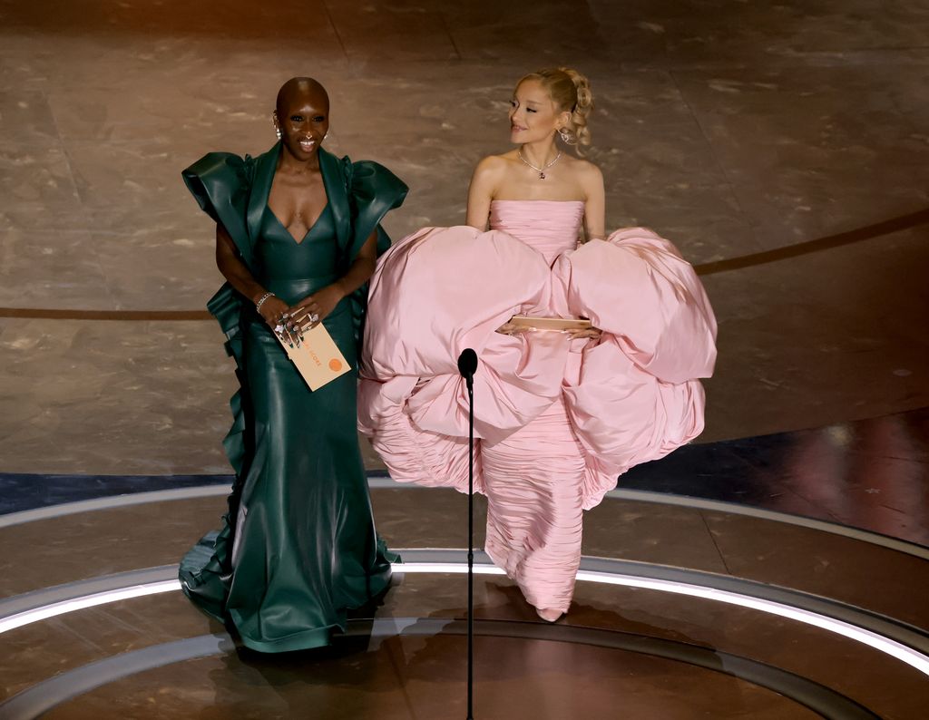 HOLLYWOOD, CALIFORNIA - MARCH 10: (L-R) Cynthia Erivo and Ariana Grande speak onstage during the 96th Annual Academy Awards at Dolby Theatre on March 10, 2024 in Hollywood, California. (Photo by Kevin Winter/Getty Images)