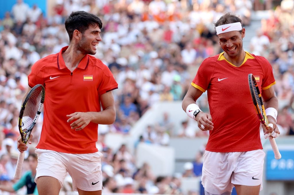 PARIS, FRANCE - JULY 30: Carlos Alcaraz of Team Spain reacts with partner Rafael Nadal of Team Spain against Tallon Griekspoor of Team Netherlands and Wesley Koolhof of Team Netherlands during the Men's Doubles second round match on day four of the Olympic Games Paris 2024 at Roland Garros on July 30, 2024 in Paris, France. (Photo by Clive Brunskill/Getty Images)