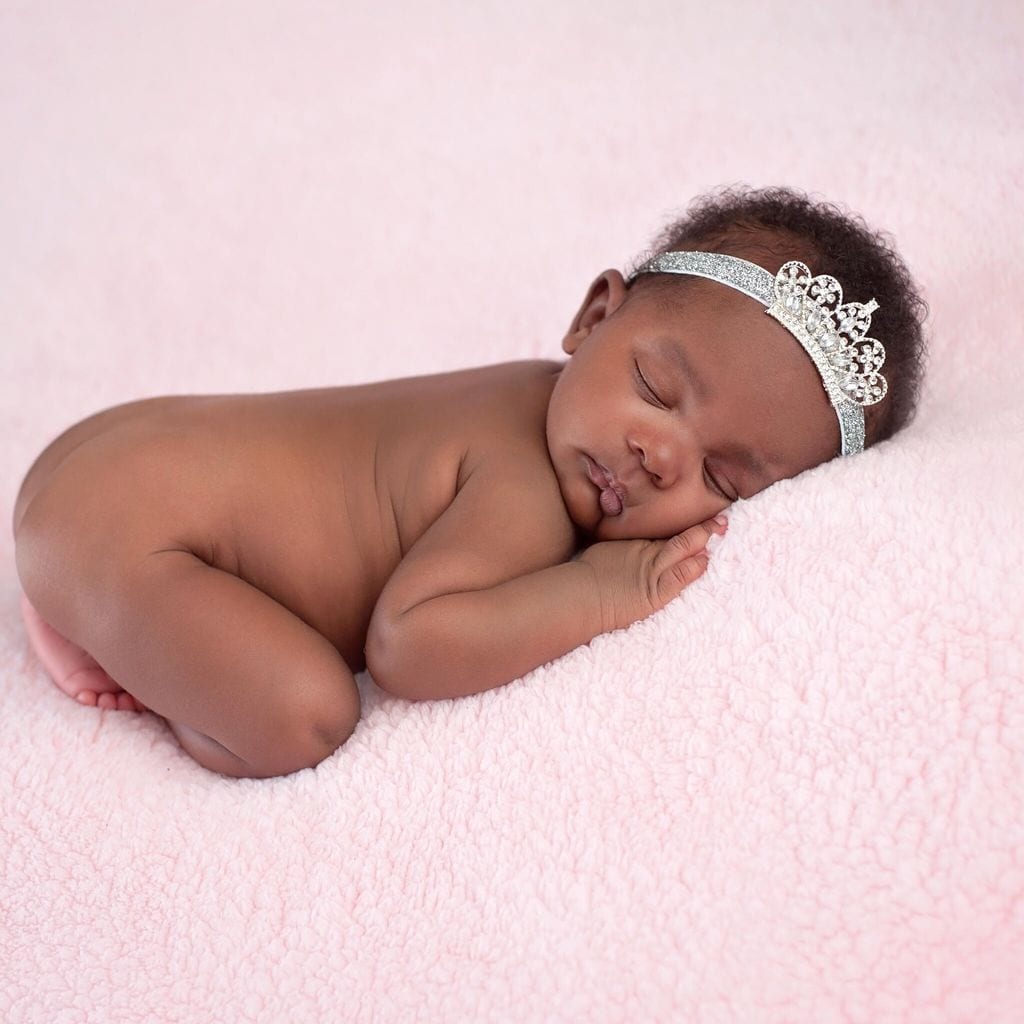 Newborn Baby Girl Wearing a Rhinestone Princess Crown