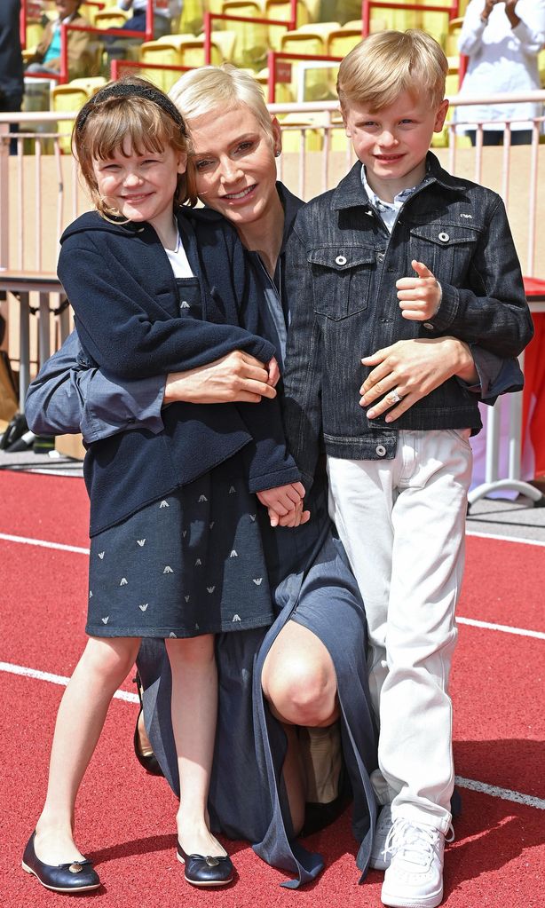 princess charlene shares sweet moments with twins during family outing see photos