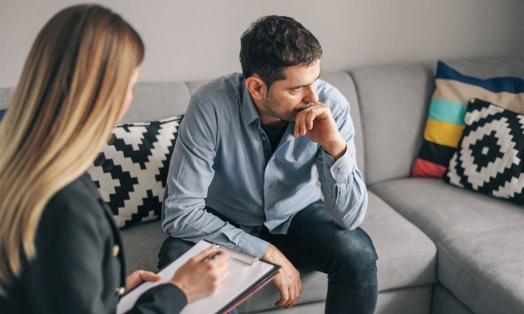 Young man, alcoholic, on therapy session