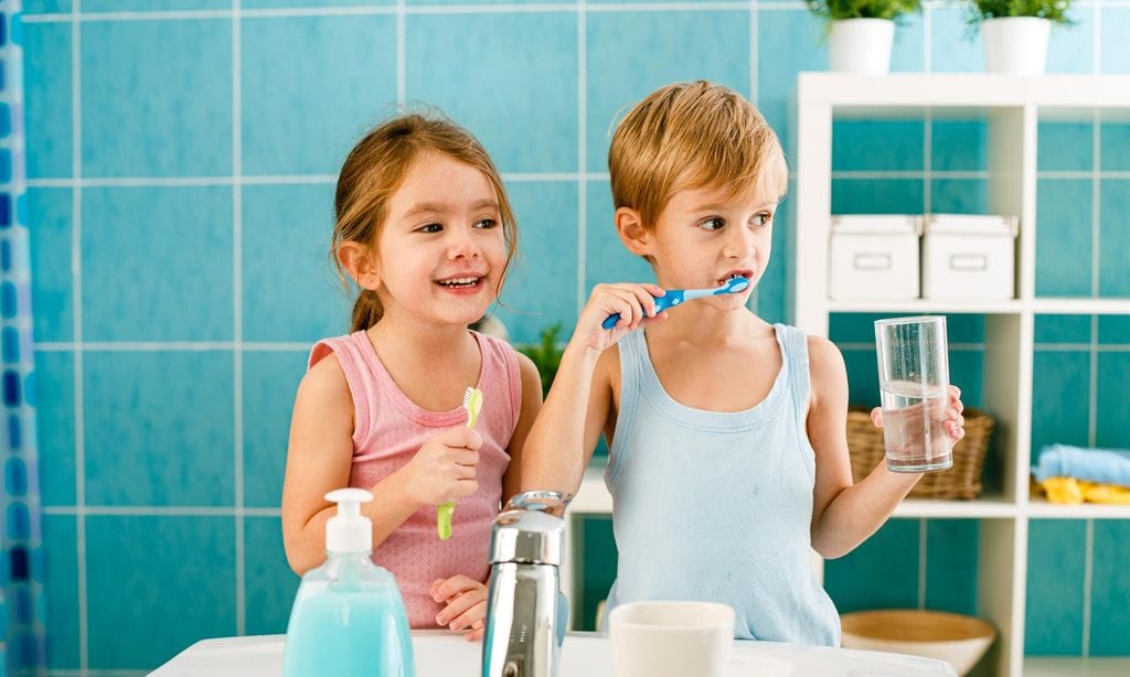 family brushing teeth in the morning