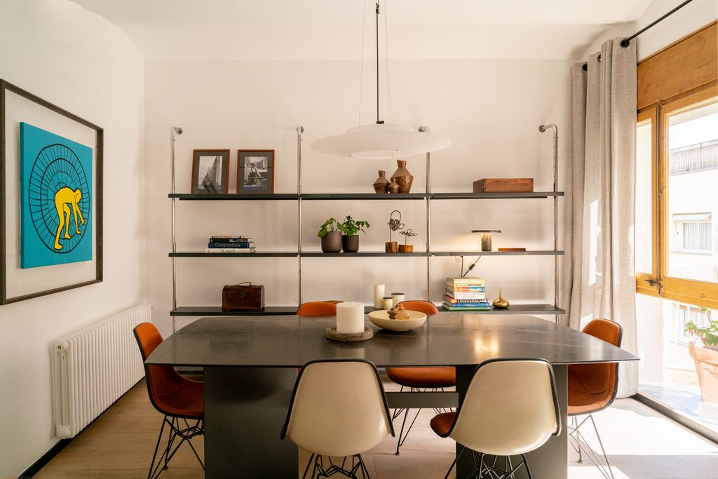 Dining room with vintage shelving in the background