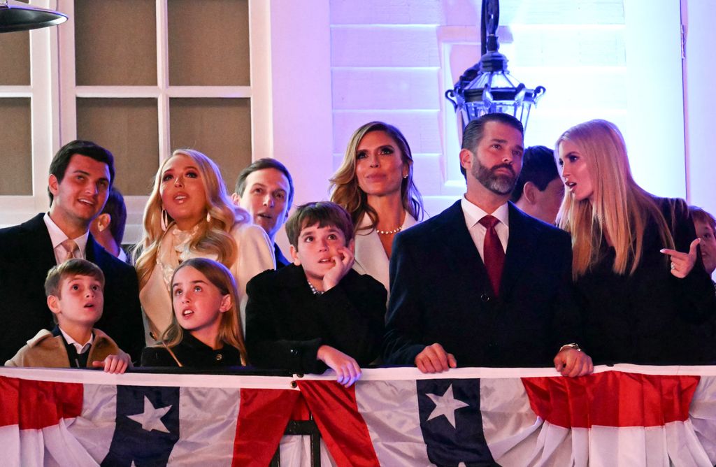 TOPSHOT - (L-R back) Michael Boulos, Tiffany Trump, Jared Kushner, Bettina Anderson, Donald Trump Jr. and Ivanka Trump watch fireworks during reception in honor US President-elect Donald Trump at Trump National Golf Club Washington DC in Sterling, Virginia, on January 18, 2025. (Photo by Jim WATSON / AFP) (Photo by JIM WATSON/AFP via Getty Images)