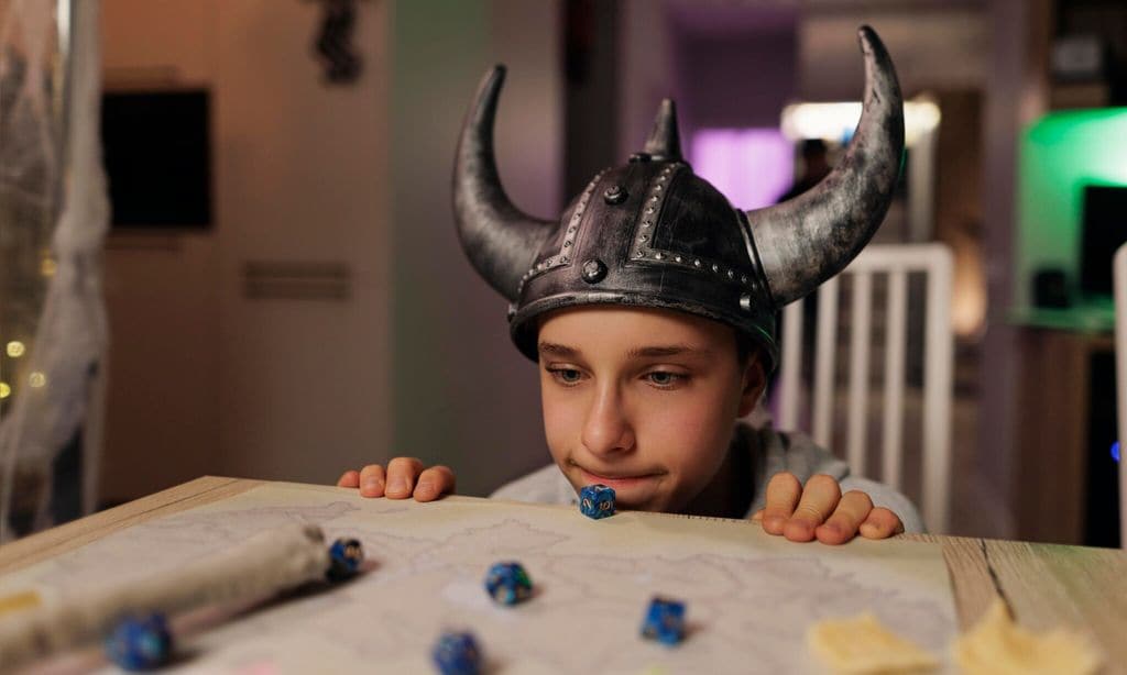 family playing custom board rpg game together at home 