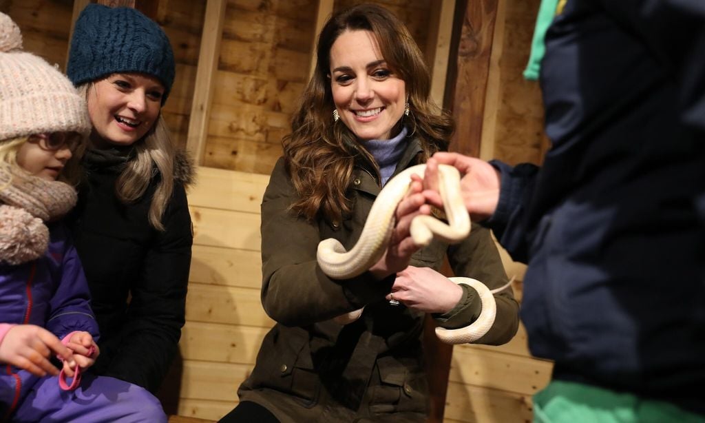 Kate Middleton held a snake for the first time during her visit to a farm in Northern Ireland