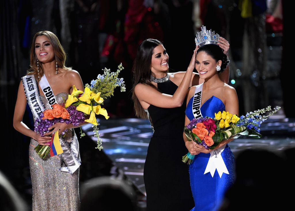 LAS VEGAS, NV - DECEMBER 20:  (L-R) Miss Colombia 2015, Ariadna Gutierrez Arevalo, looks on as Miss Universe 2014 Paulina Vega crowns Miss Philippines 2015, Pia Alonzo Wurtzbach, the new Miss Universe during the 2015 Miss Universe Pageant at The Axis at Planet Hollywood Resort & Casino on December 20, 2015 in Las Vegas, Nevada. Gutierrez Arevalo was first crowned Miss Universe after host Steve Harvey mistakenly named her the winner instead of first runner-up. (Photo by Ethan Miller/Getty Images)