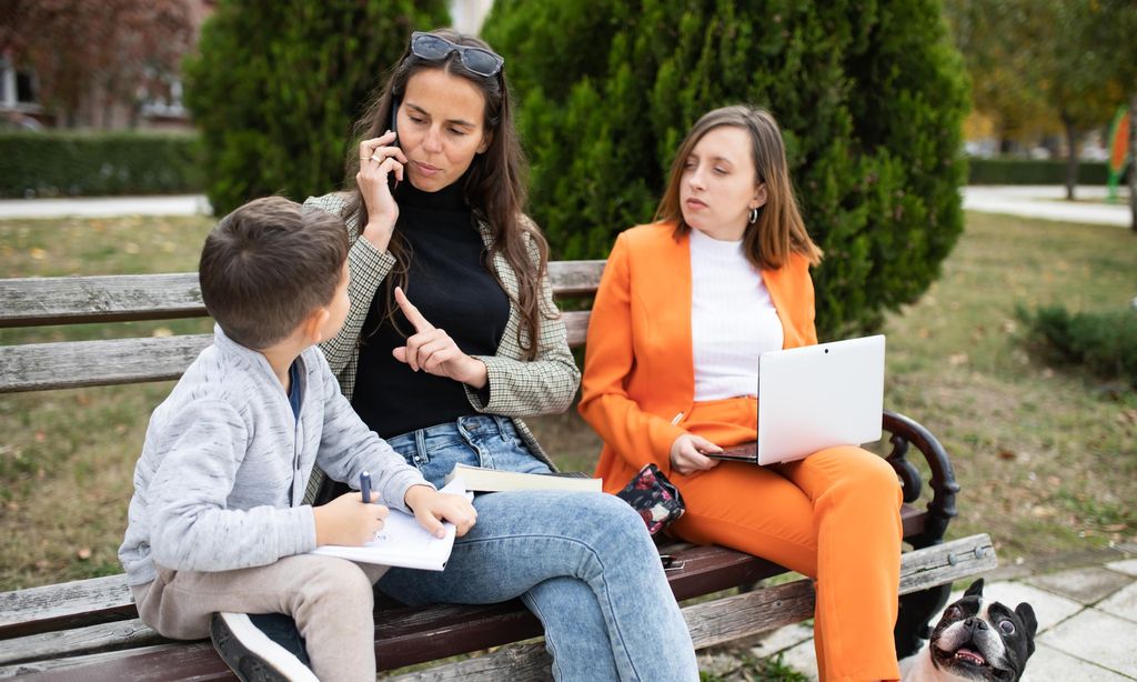 Kid interrupting his mom\'s telephone conversation