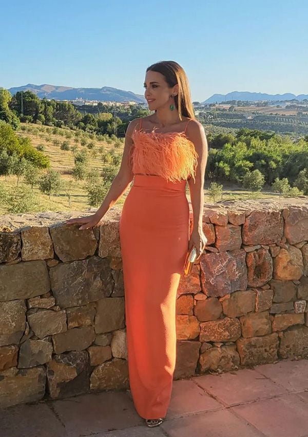 Paula Echevarría con look naranja en una boda