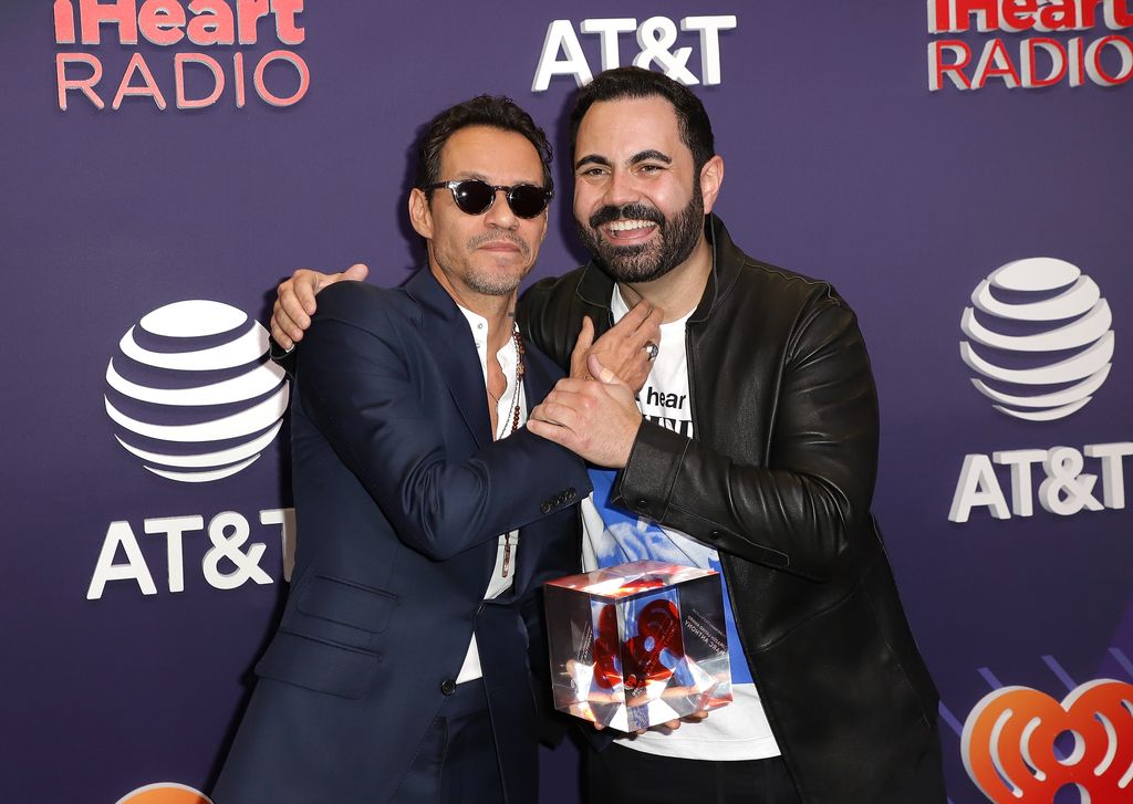 Marc Anthony y Enrique Santos.