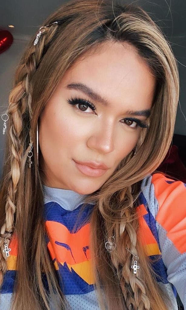 Karol G new braided look with hair jewelry