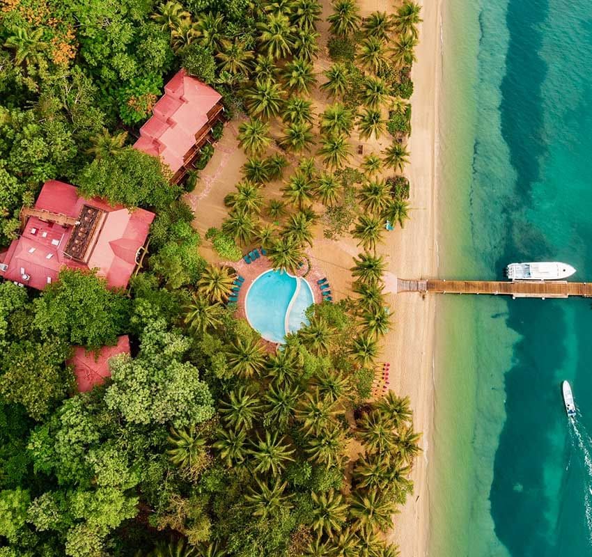 hamanasi resort beach aerial with dive boat