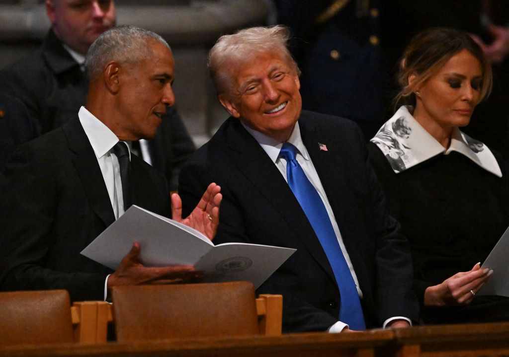 Former US President Barack Obama and President-elect Donald Trump speak ahead of the state funeral services for former President Jimmy Carter at the National Cathedral on January 9, 2025 in Washington, DC. (Photo by Ricky Carioti / POOL / AFP) (Photo by RICKY CARIOTI/POOL/AFP via Getty Images)