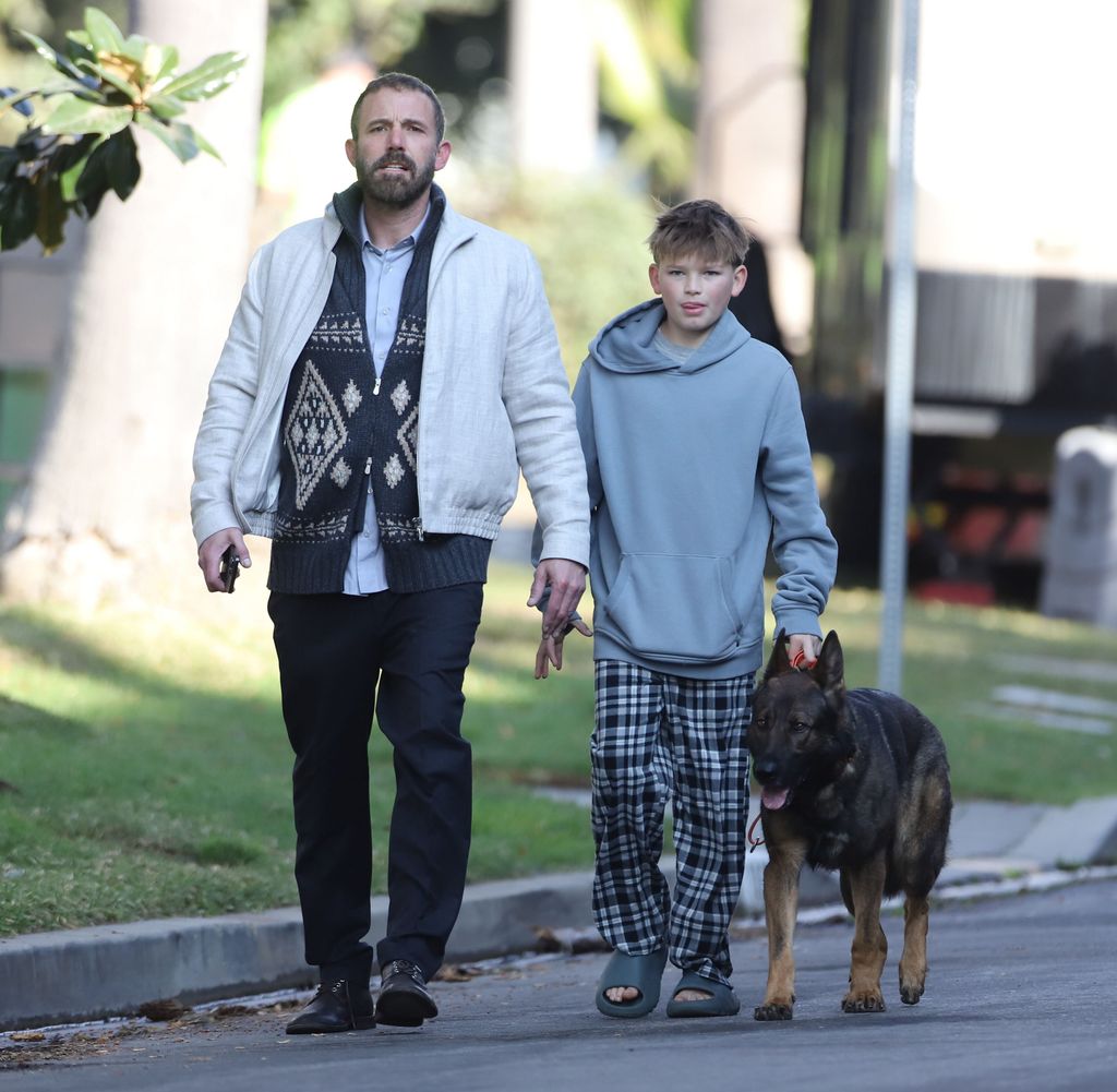 Ben Affleck walks dog in front of national guardsmen in Palisades Jan 18, 2025 /X17online.com