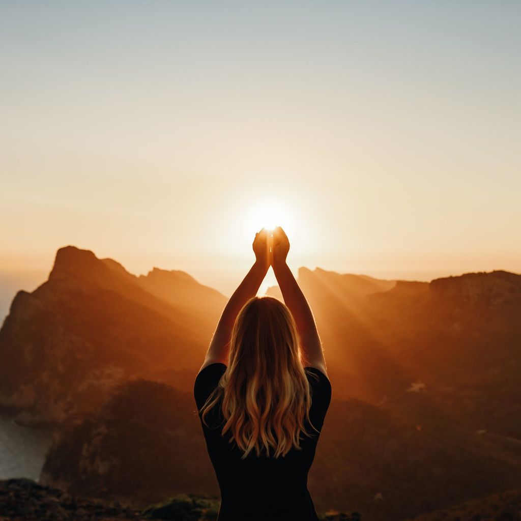 Young woman in spiritual pose holding the light