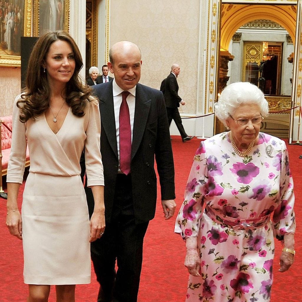 Britain\'s Queen Elizabeth II (R) walks w