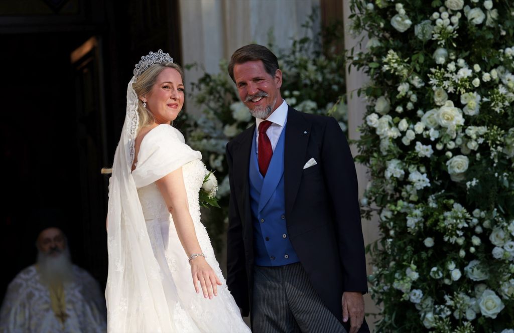 Theodora of Greece arrives at the Cathedral of the Annunciation of Saint Mary arm in arm with her brother Paul to marry Matthew Kumar, on September 28, 2024, in Athens (Greece)