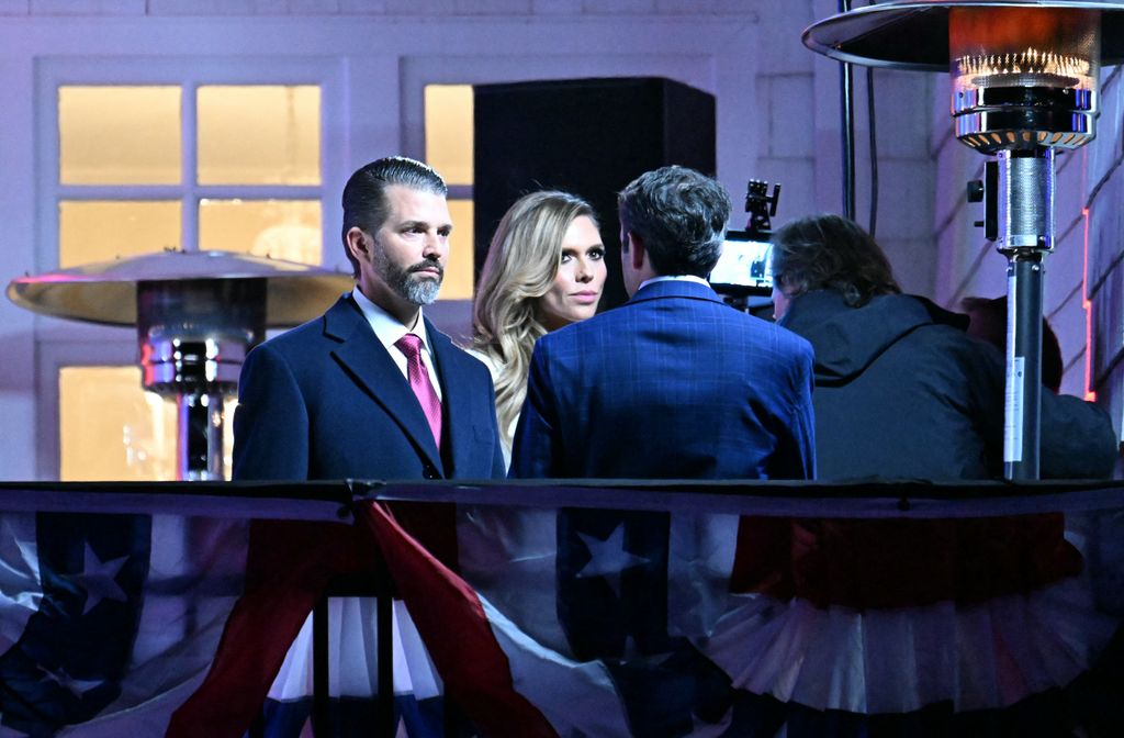 Donald Trump Jr. and girlfriend Bettina Anderson ready to watch fireworks during reception in honor US President-elect Donald Trump at Trump National Golf Club Washington DC in Sterling, Virginia, on January 18, 2025. (Photo by Jim WATSON / AFP) (Photo by JIM WATSON/AFP via Getty Images)