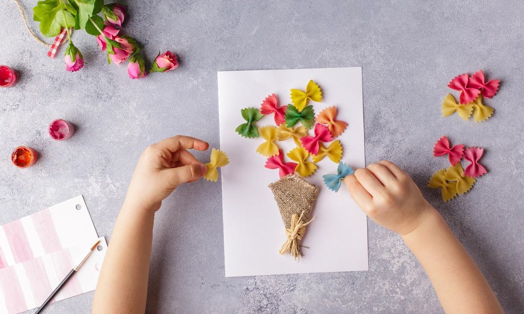 paper crafts for mother day 8 march or birthday small child doing a bouquet of flowers out of colored paper and colored pasta