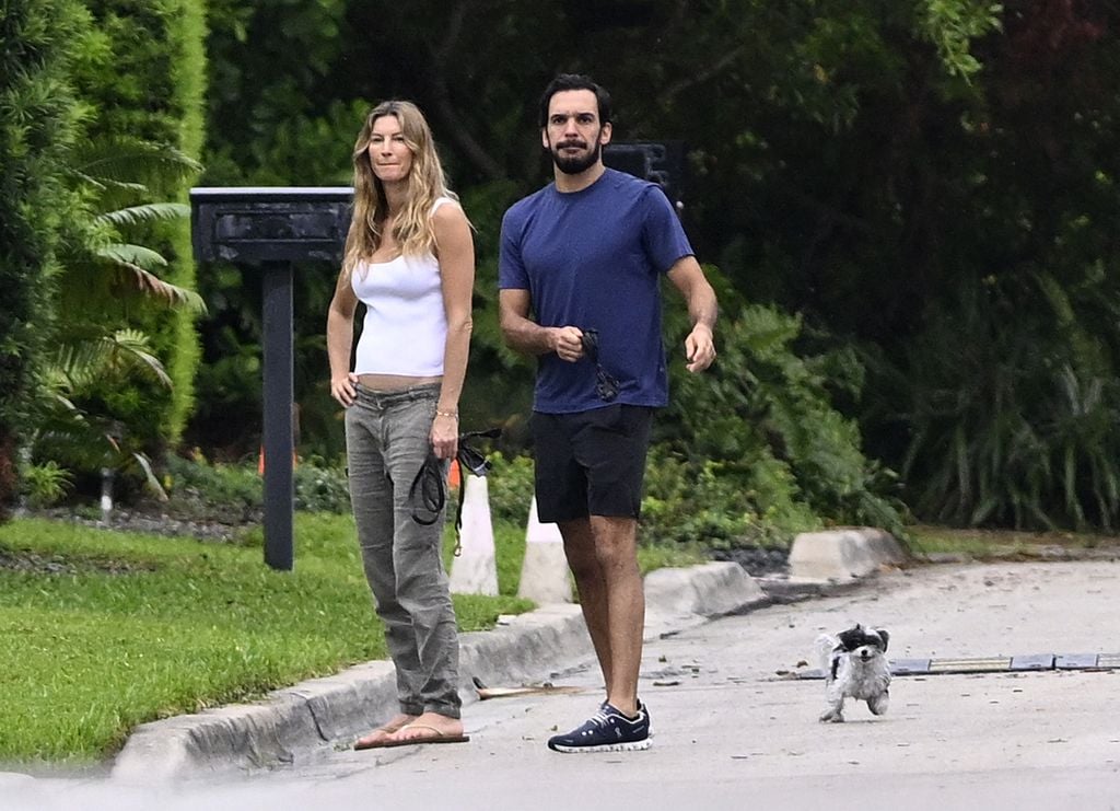 Photo Â© 2024 Mega/The Grosby Group

PREMIUM EXCLUSIVE

Gisele BÃ¼ndchen and handsome boyfriend Joaquim Valente put on a loved-up display as they walk the dogs in Surfside, Florida. In fact, such is the strength of their relationship, Valente has moved into the supermodelâs $11.5 million newly-renovated Miami mansion, debunking false rumors of a split. Breakup speculation around the catwalk queen and her jiujitsu trainer boyfriend, 36, could not be further from the truth, as these exclusive photos show the Brazilian-born lovebirds have taken their romance to the next level by setting up home together. These stunning aerial images reveal the newly renovated dream home, where the two have been staying together, in all its glory having undergone a huge facelift. Nestled in a ritzy neighborhood just across Biscayne Bay from ex-husband Tom Bradyâs newly-built mansion, the 43-year-oldâs sleek two-storey property boasts a glistening pool, sprawling sundeck and freshly resurfaced balcony off the master bedroom. A new roof and floor-to-ceiling windows were also part of the contemporary makeover, which has spanned 18 months. Further disproving reports that their love affair was over, these aerial shots clearly show Valenteâs truck parked in the driveway of the residence. And debunks claims that their affair was âfizzling outâ amid stress sparked by public attention and Bradyâs brutal Netflix roast. These images prove the duo are still firmly an item although they have been staying low key and not been pictured together in months. Gisele is known to have been traveling to and from her native Brazil in the wake of her motherâs recent death. She had splashed out on the Surfside fixer-upper in November 2022 while NFL legend Brady kept the ambitious new construction they had originally started together just a stoneâs throw away on Indian Creek Island, dubbed âBillionaire Bunkerâ. During her own renovation project, Gisele had been staying at a different pad cl