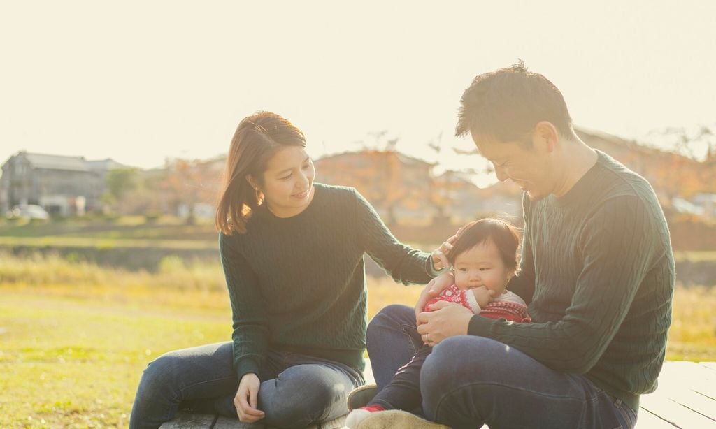 happy family having a good time with baby girl