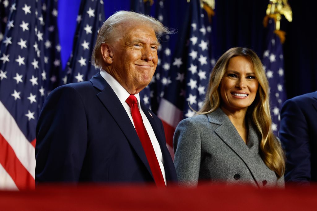 WEST PALM BEACH, FLORIDA - NOVEMBER 06:  Republican presidential nominee, former U.S. President Donald Trump and former first lady Melania Trump look on during an election night event at the Palm Beach Convention Center on November 06, 2024 in West Palm Beach, Florida. Americans cast their ballots today in the presidential race between Republican nominee former President Donald Trump and Vice President Kamala Harris, as well as multiple state elections that will determine the balance of power in Congress.   (Photo by Chip Somodevilla/Getty Images)