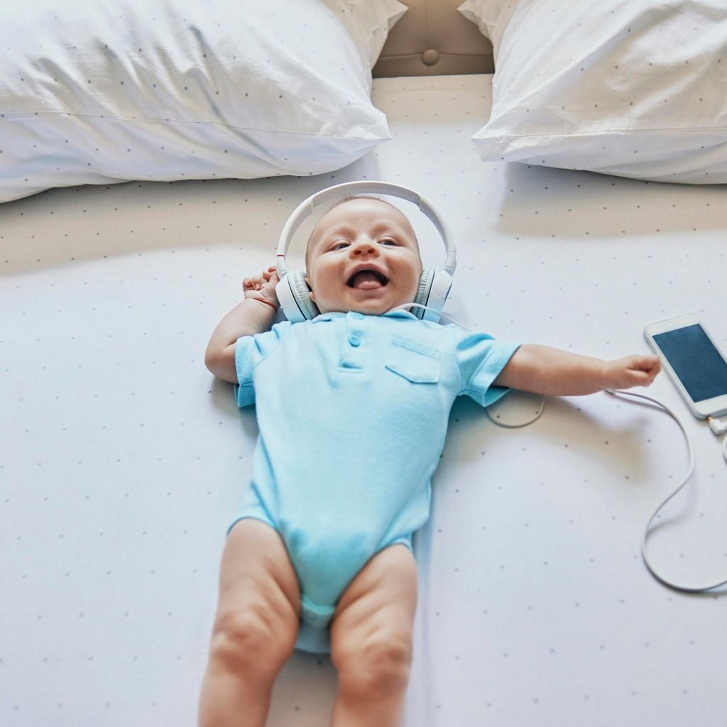 awsome baby enjoying listening to music