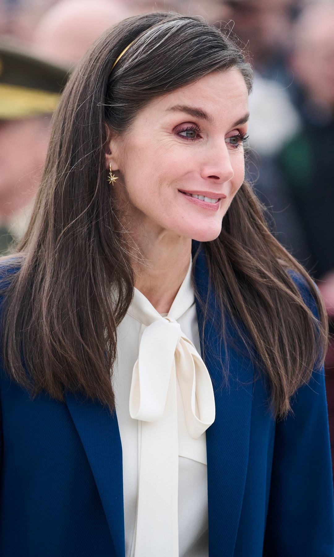 Queen Letizia with golden headband in Juan Sebastian de Elcano dismissing Princess Leonor