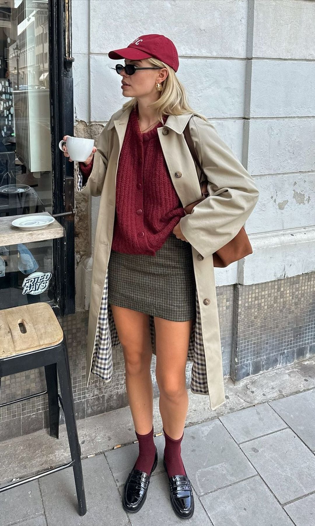 Miniskirt with loafers, burgundy sweater and trench coat