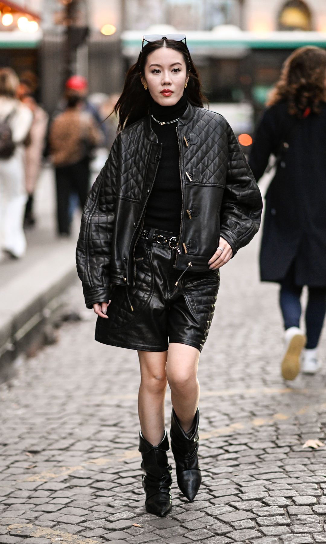 Bomber and black padded leather bermuda shorts and boots