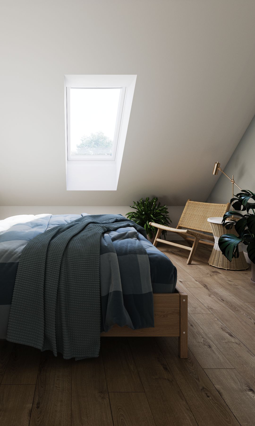 Dormitorio abuhardillado con ventana de techo, suelo de madera y rincón de lectura con butaca de fibras vegetales y lámpara de pie