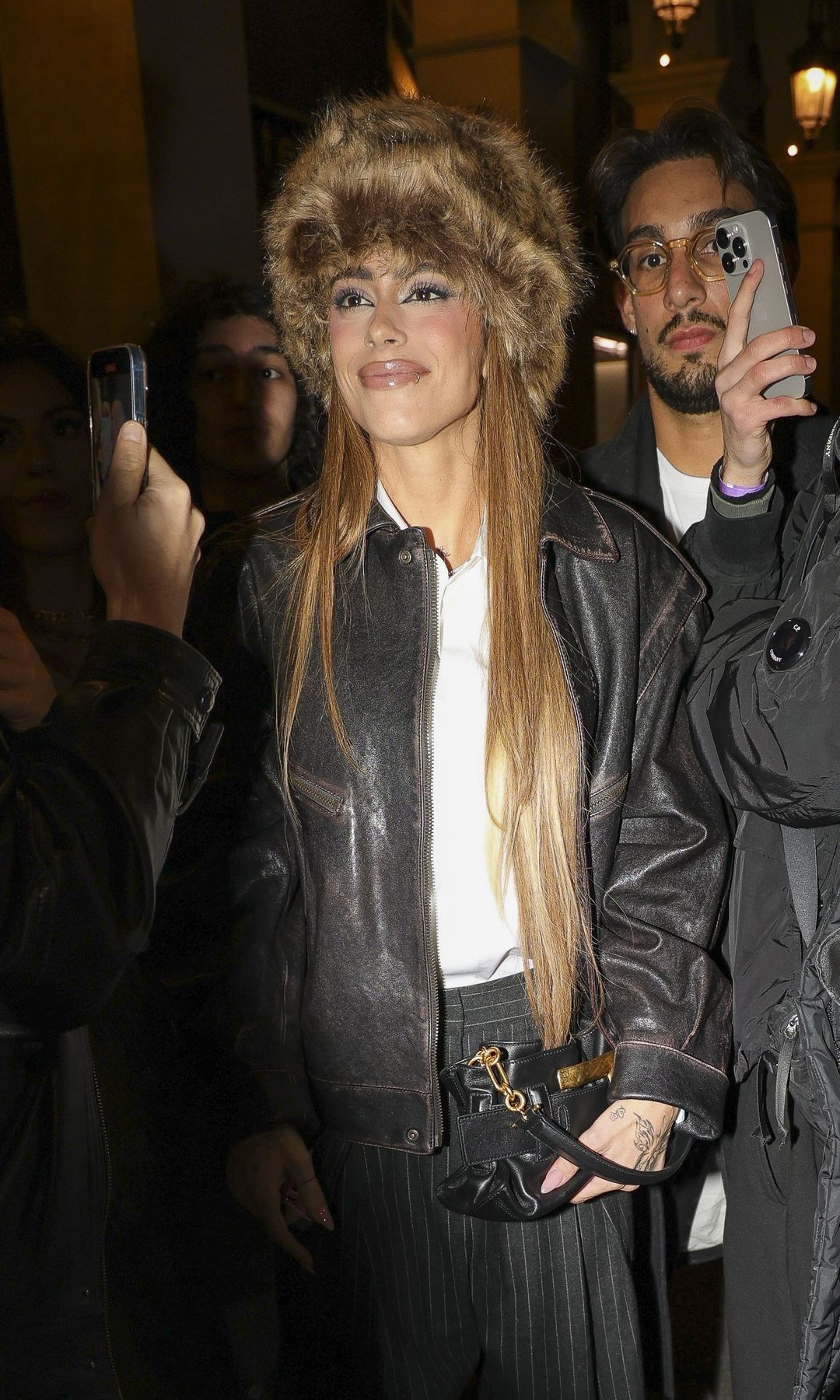 Tini wore an iconic Eskimo hat upon his arrival in Paris