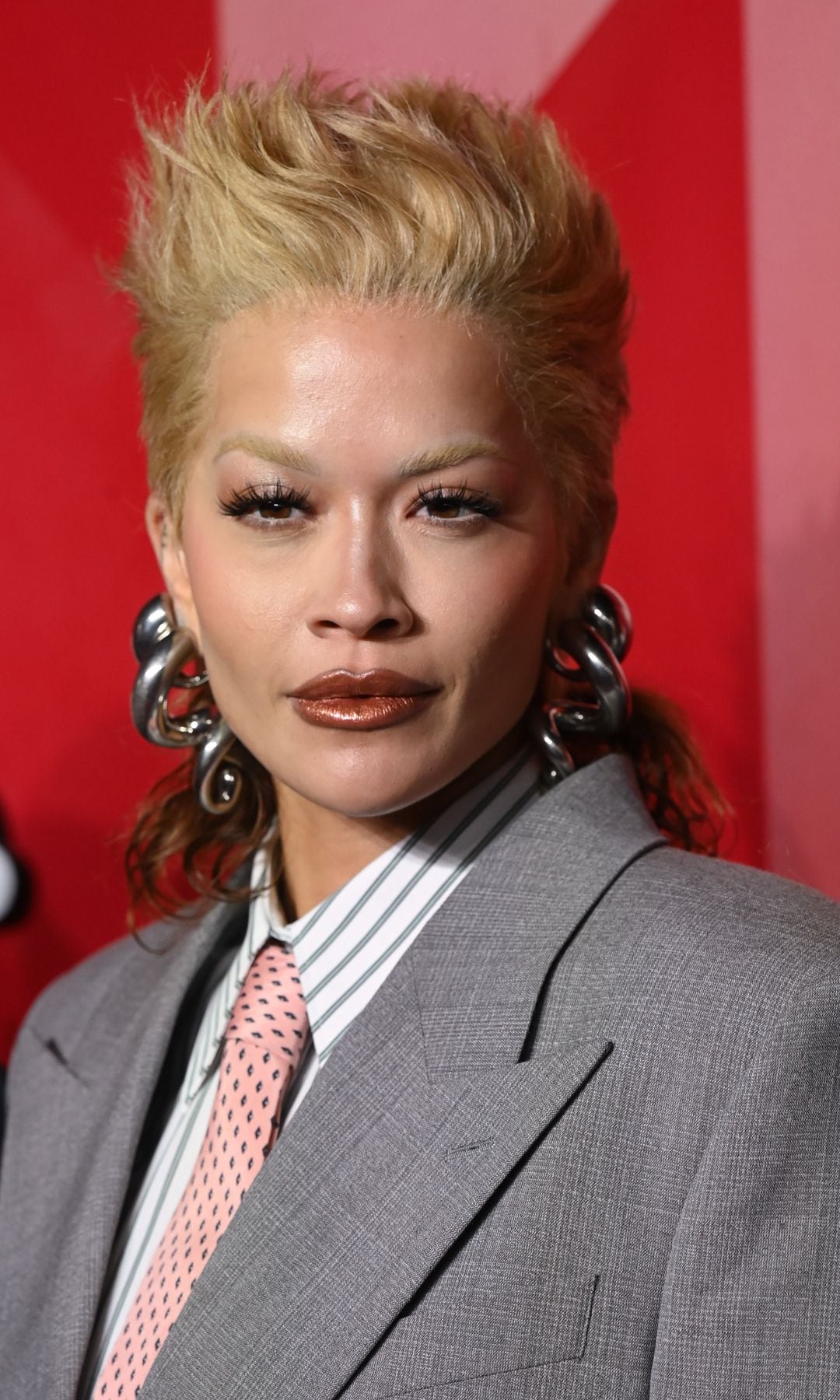 Rita Ora with short hair and a suit at the Fashion Awards 2024