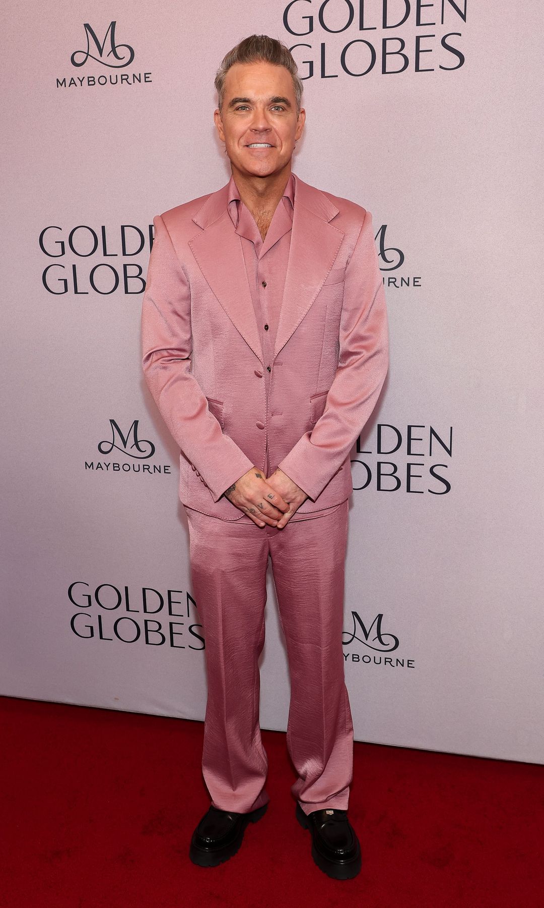 Robbie Williams en la celebración de los nominados a los Globos de Oro 2025