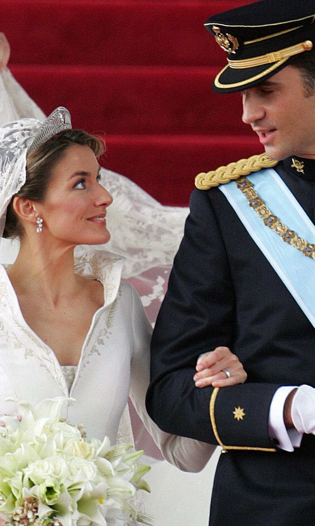 MADRID, Spain:  Princess of Asturias Letizia Ortiz and her husband Spanish Crown Prince Felipe of Bourbon smile as they leave Madrid's Almudena Cathedral at the end of their wedding ceremony 22 May 2004. AFP PHOTO POOL ODD ANDERSEN  (Photo credit should read ODD ANDERSEN/AFP via Getty Images)