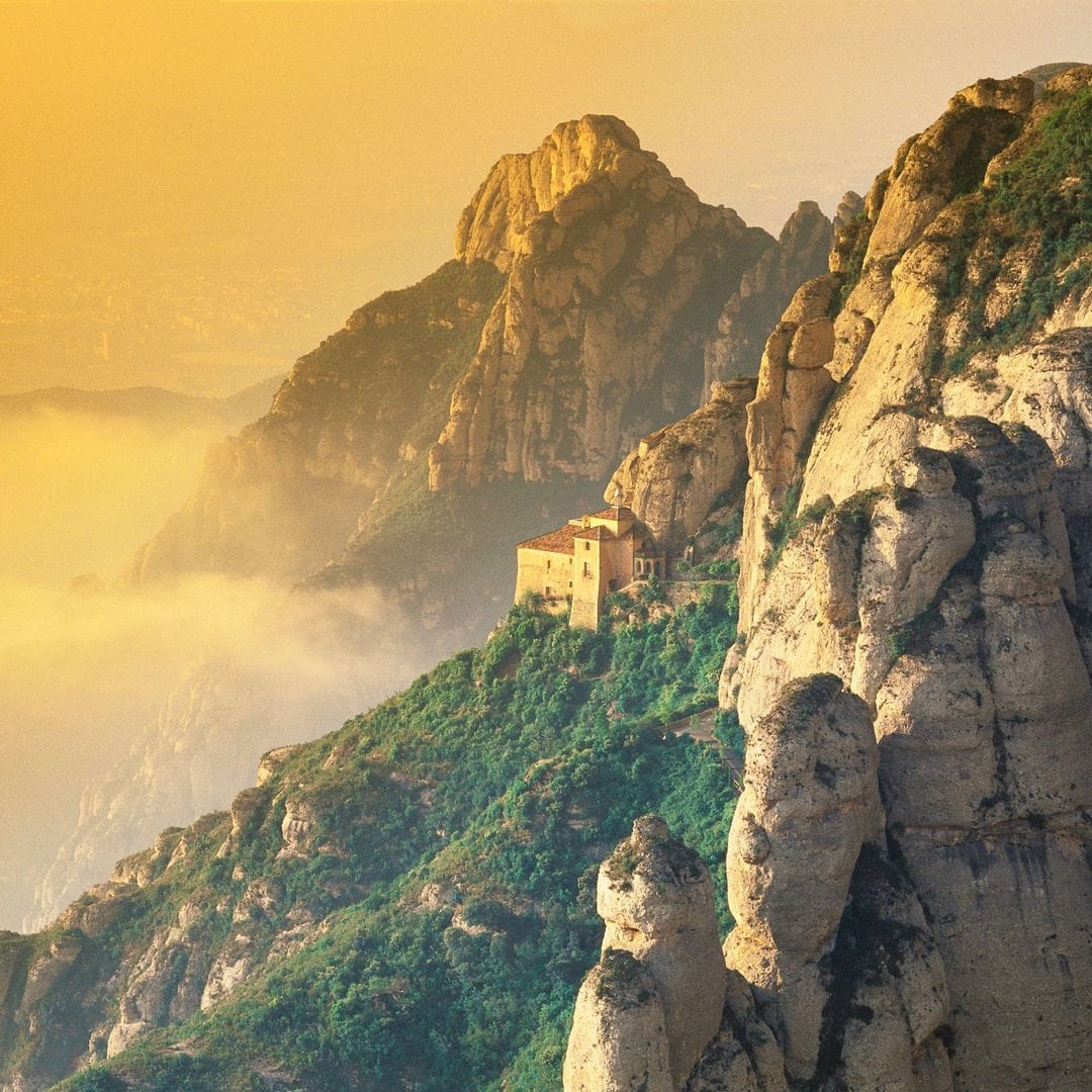 Cueva Santa del monasterio de Montserrat al atardecer, Barcelona on mountainside at sunrise, Sierra de Montserrat, Catalonia, Spain