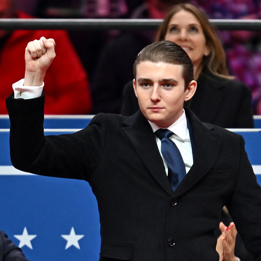 Barron Trump gestures after being acknowledged by his father US President Donald Trump during the inaugural parade inside Capital One Arena, in Washington, DC, on January 20, 2025. (Photo by ANGELA WEISS / AFP) (Photo by ANGELA WEISS/AFP via Getty Images)