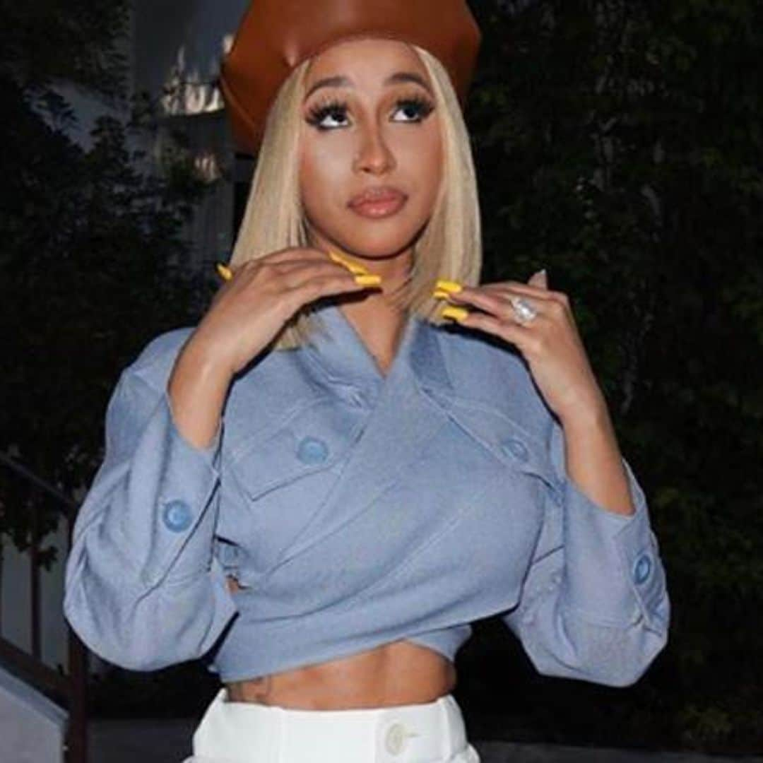 Cardi B shows off incredible toned abs as she raps in crop top