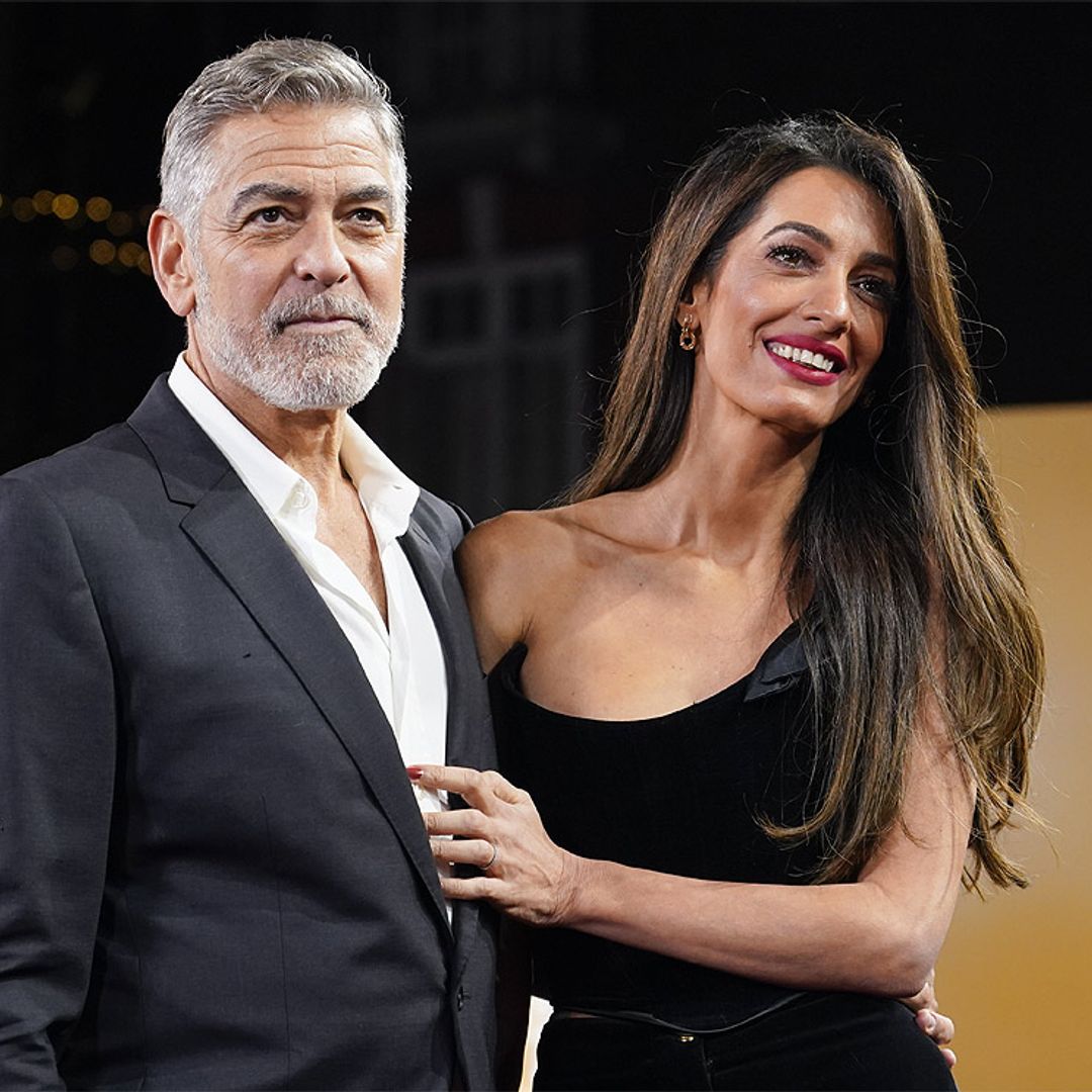 George y Amal Clooney, amor bajo la lluvia y sobre la alfombra roja en una noche muy importante para el actor