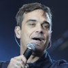 Robbie Williams, enamorado y listo para ser padre, anuncia su regreso junto a Take That