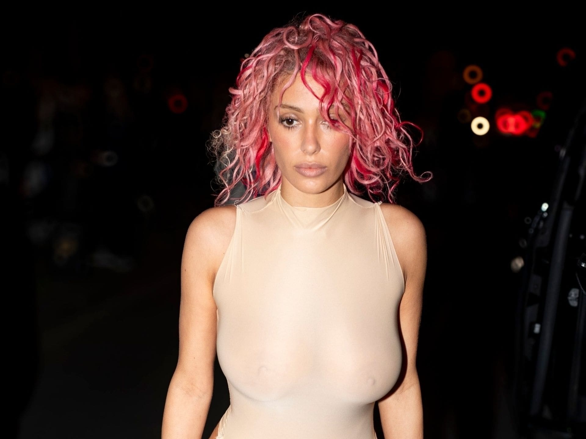 Bianca Censori steps out in sheer cut-out bodysuit and pink hair