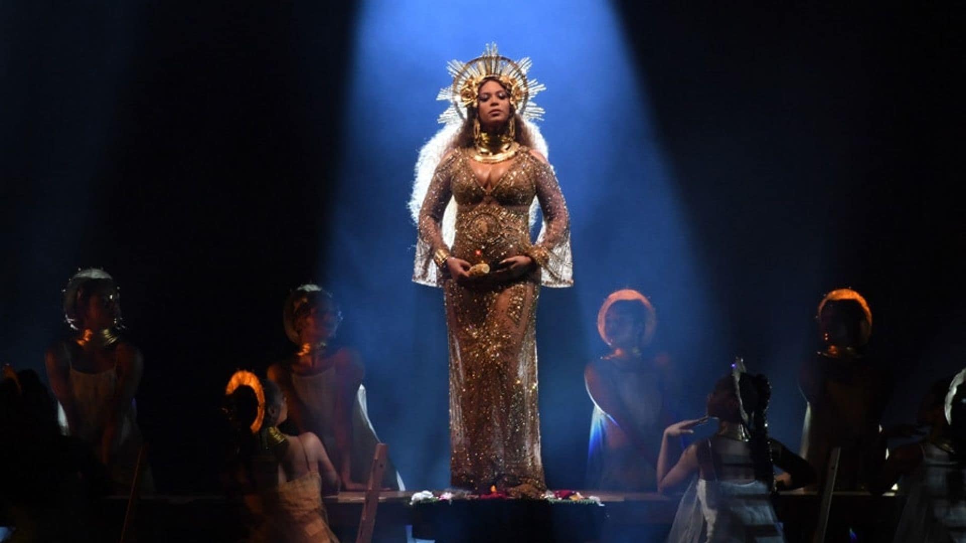 Beyoncé cradles growing baby bump during Grammys performance