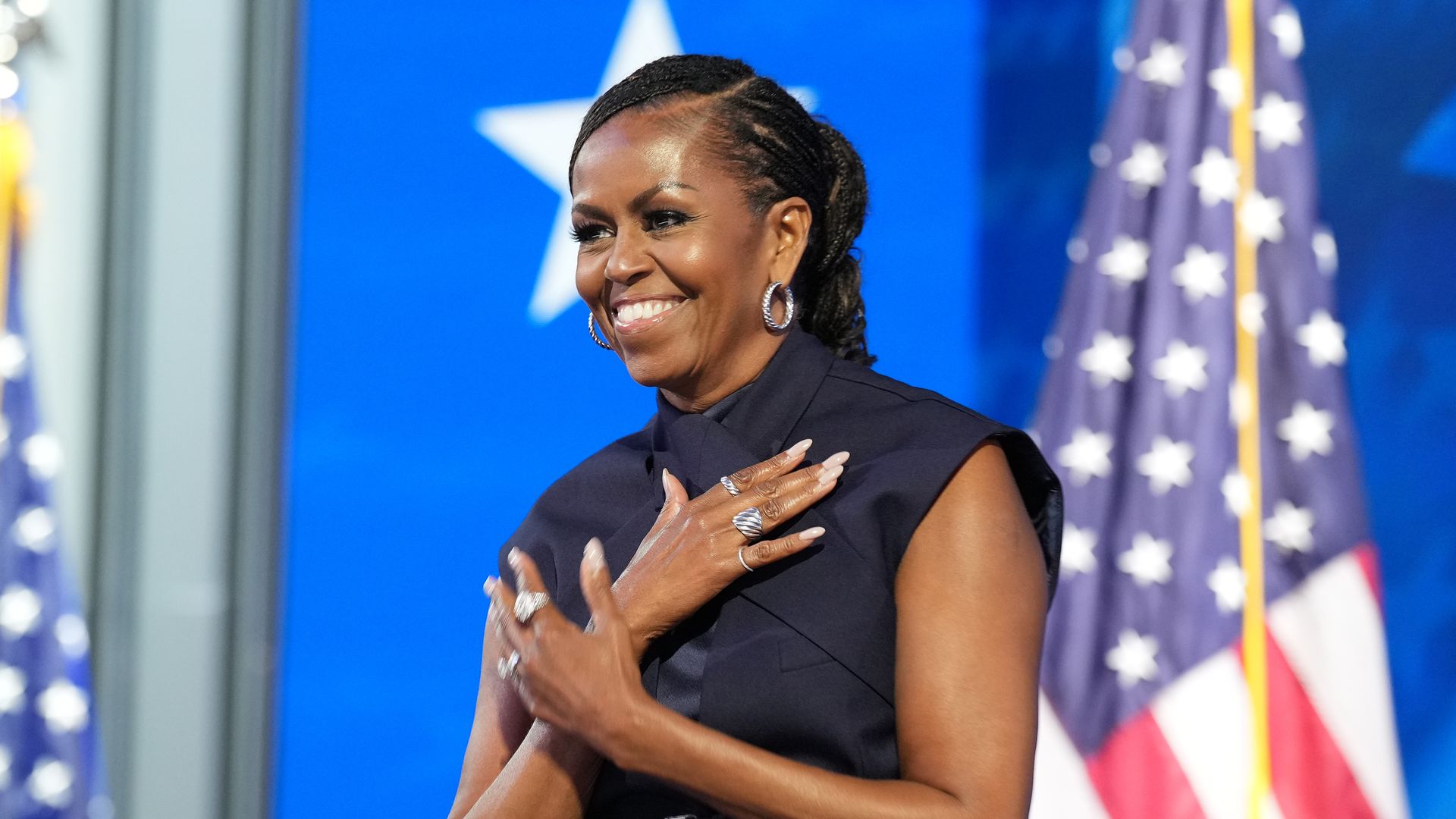 Michelle Obama looked effortlessly cool in a crisscross sleeveless suit at the 2024 DNC