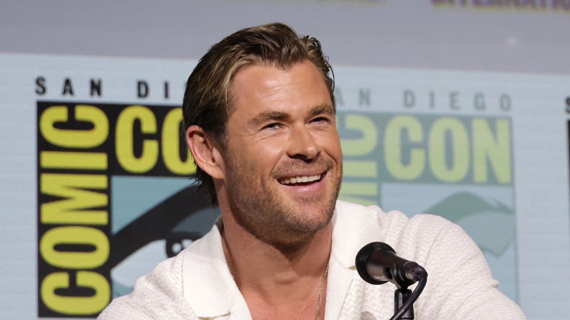 Chris Hemsworth practices his hairstylist skills on his son