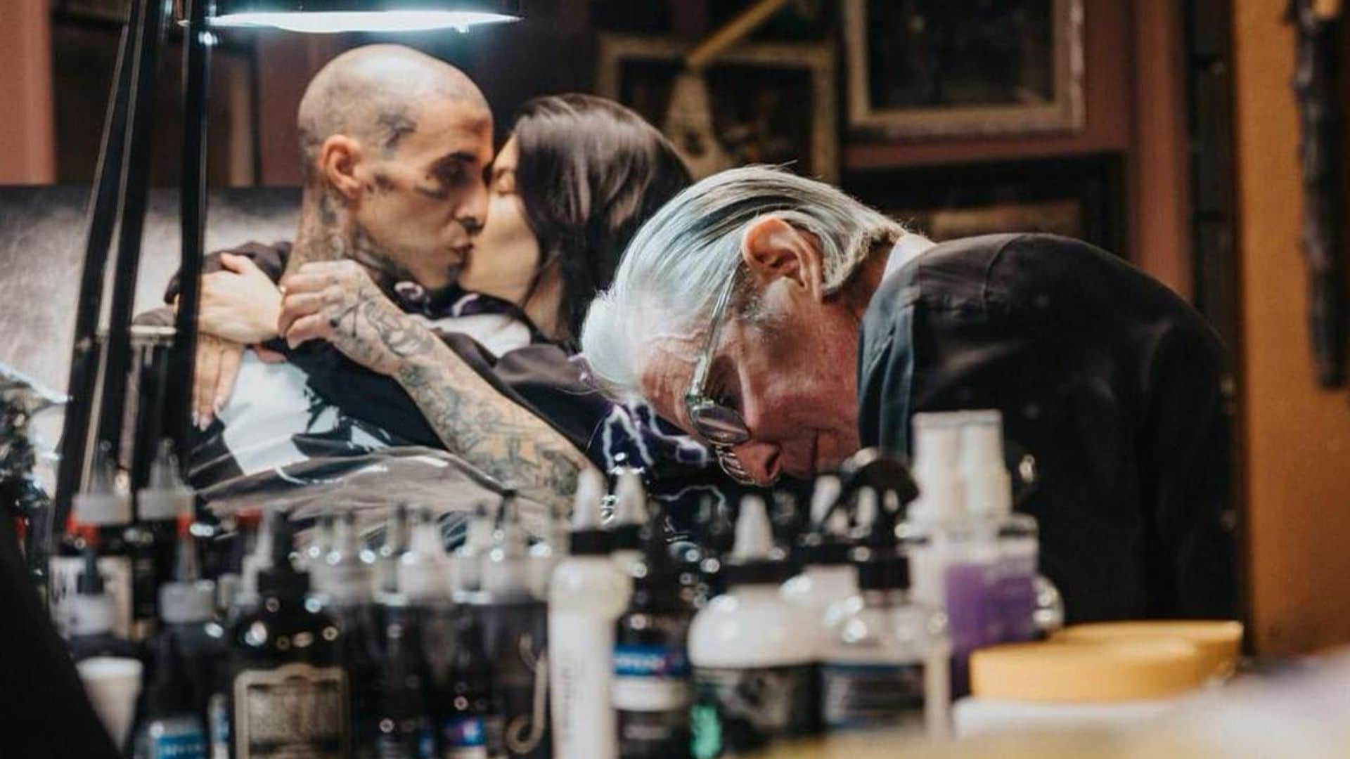 Kourtney Kardashian comforts Travis Barker as he gets a tattoo honoring late Foo Fighters drummer Taylor Hawkins