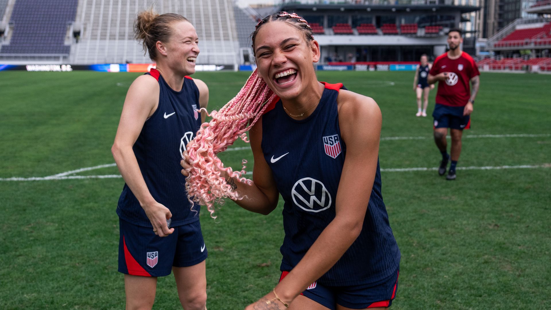 Emily Sonnett and Trinity Rodman of the United States laugh after a USWNT training session at Audi Field on July 15, 2024, in Washington, DC.